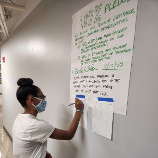  Student signing a pledge